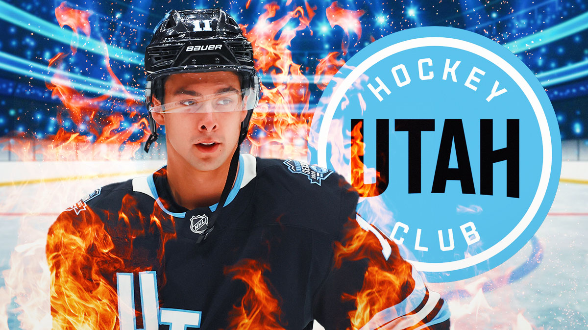 Dylan Guenther looking happy with fire around him, Utah Hockey Club logo, hockey rink in background