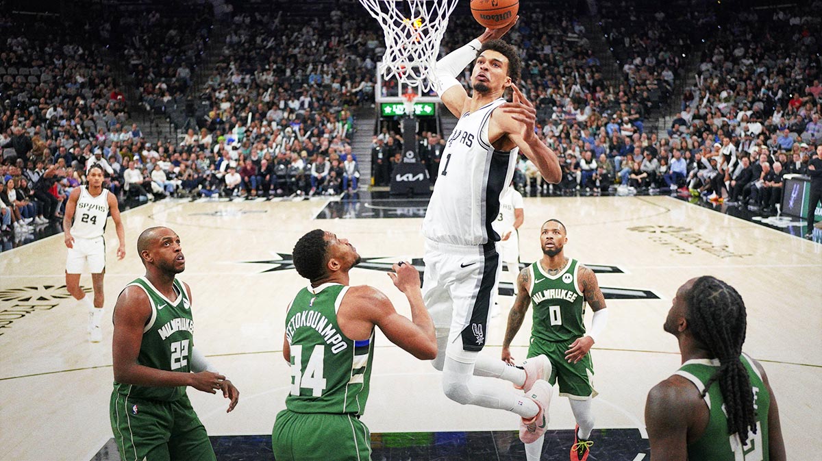 San Antonio Spurs center Victor Wembanyama (1) dunks over Milwaukee Bucks forward Giannis Antetokounmpo (34) during the second half at Frost Bank Center. 