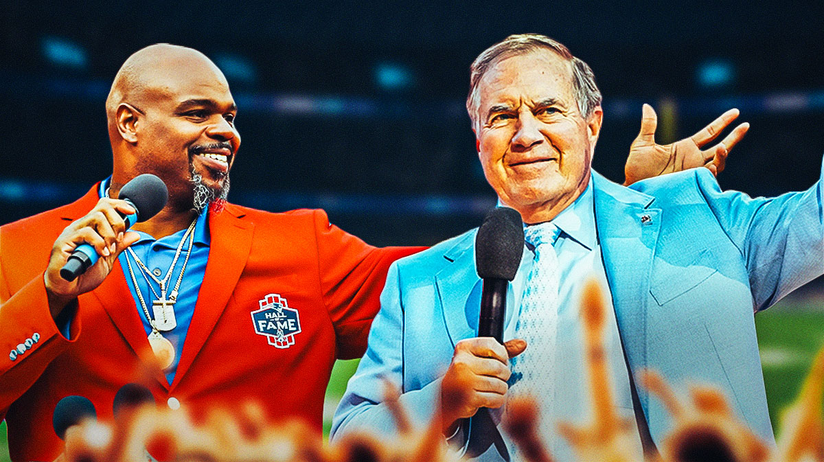 Vince Wilfork is looking at Patriots head coach Bill Belichick looking at a call sheet.