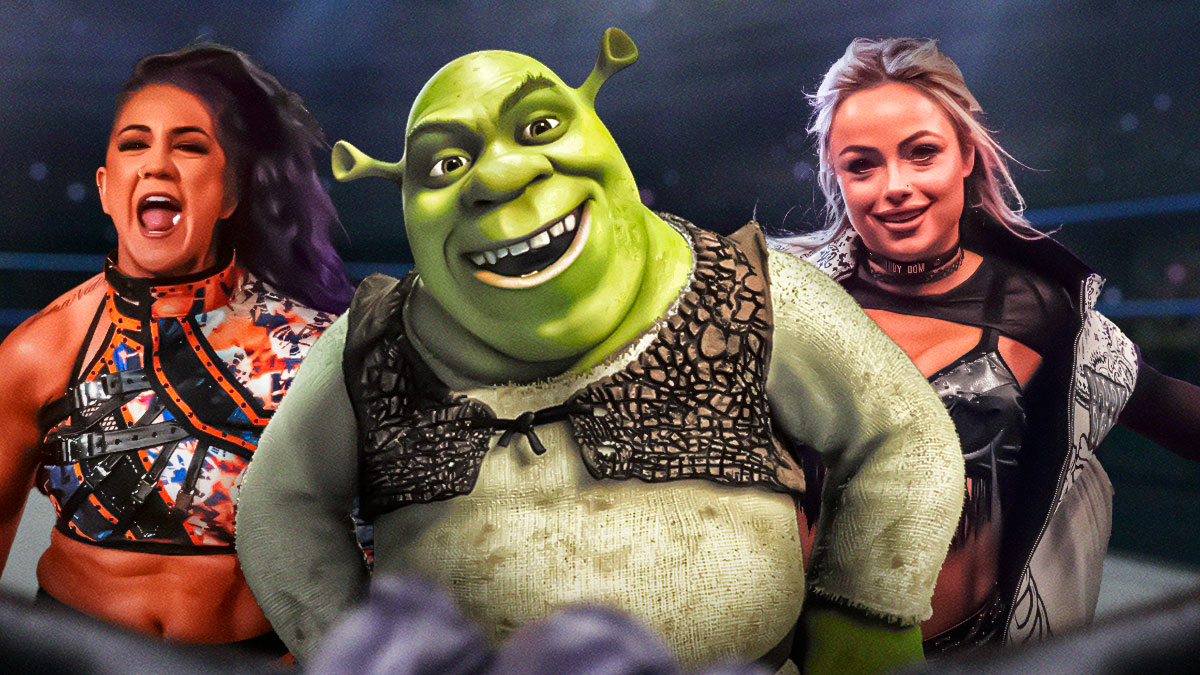 Shrek 5 character Shrek in between Bayley and Liv Morgan in a wrestling ring.