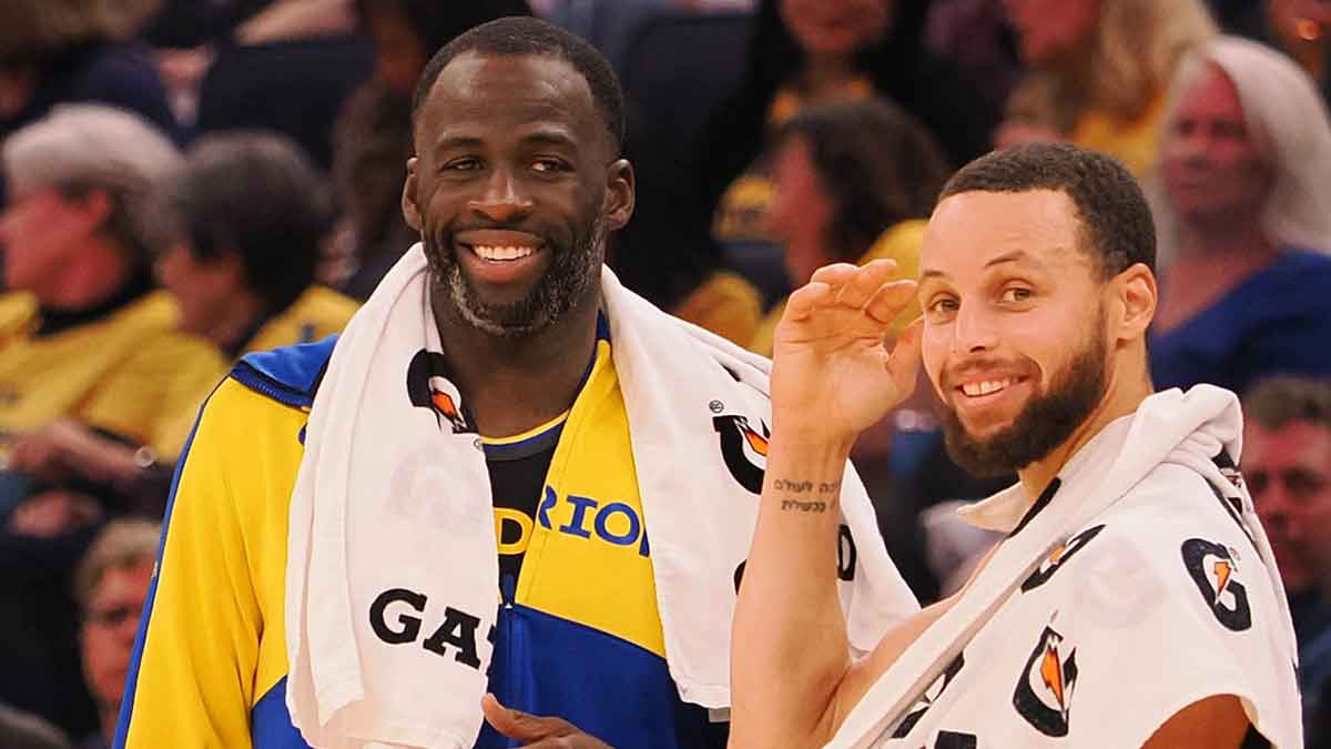 The golden state warriors forward Draimond Green (23) and preserve Stephen Curri (30) waiting to enter the game during the second quarter against Orlando magic in Chase Center.