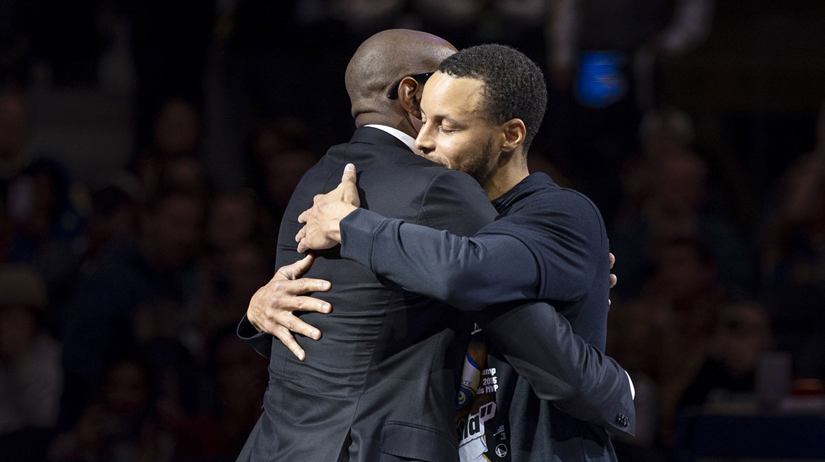 Golden State Warriors guard Stephen Curry (30) hugs Andre Iguodala during the Andre Iguodala jersey retirement ceremony at Chase Center.