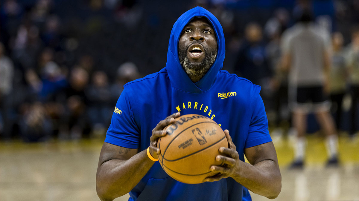 Warriors forward Draymond Green (23) warms up before the game against the Dallas Mavericks at Chase Center