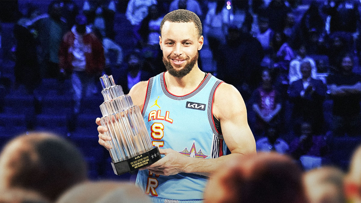 Warriors' Stephen Curry smiling while holding the All-Star Game MVP award
