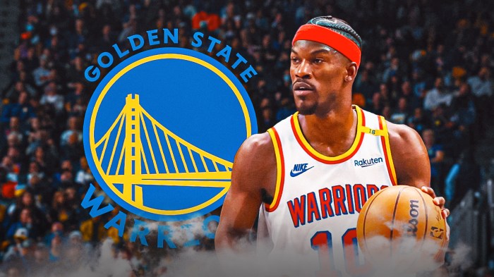Jimmy Butler in Warriors gear. Warriors logo in the background.