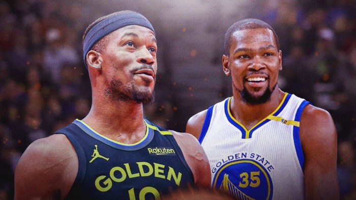 Warriors' Jimmy Butler smiling, with Kevin Durant in Warriors uniform (2016 version) beside him