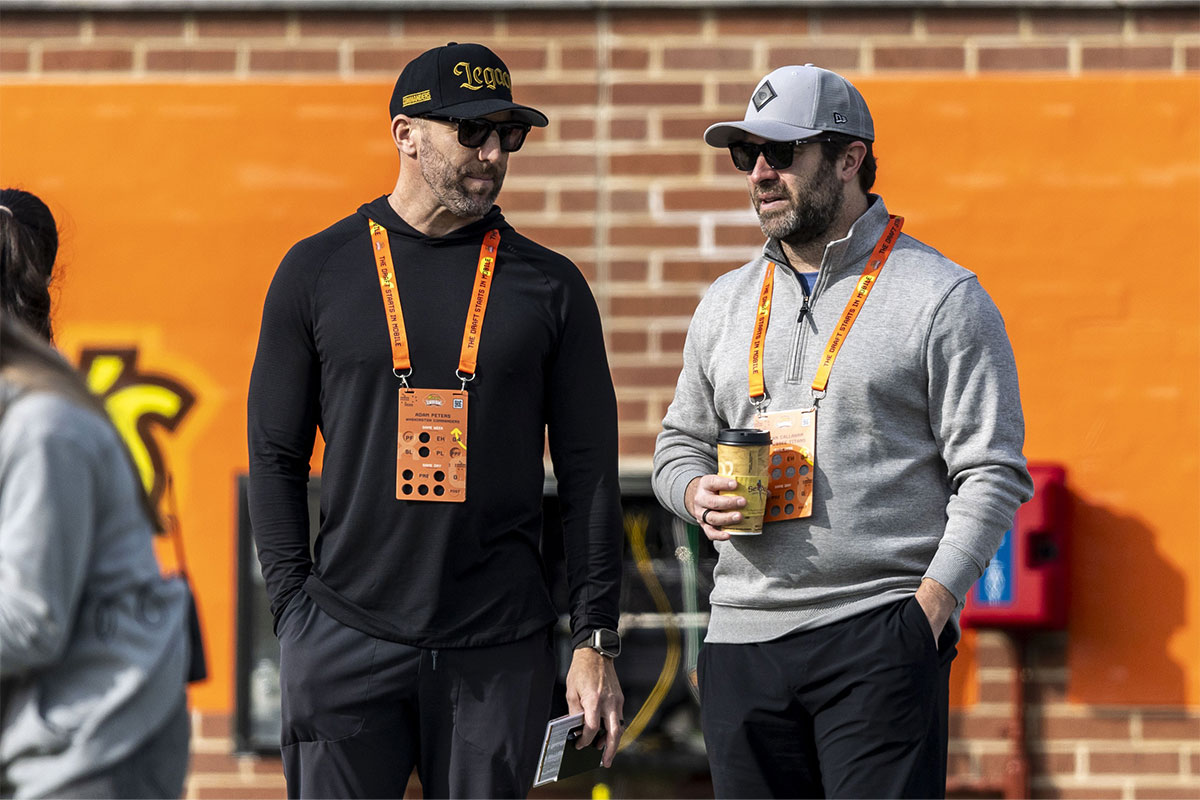 Washington Commanders general manager Adam Peters talks with Tennessee Titans head coach Brian Callahan during Senior Bowl practice for the National team at Hancock Whitney Stadium.