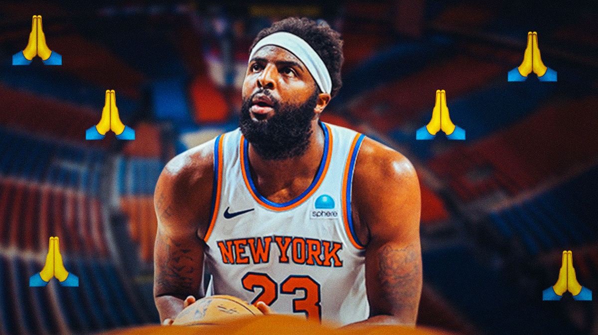 Knicks' Mitchell Robinson with praying hands emojis all around him
