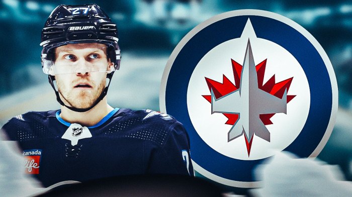 Nikolaj Ehlers next to Winnipeg Jets logo