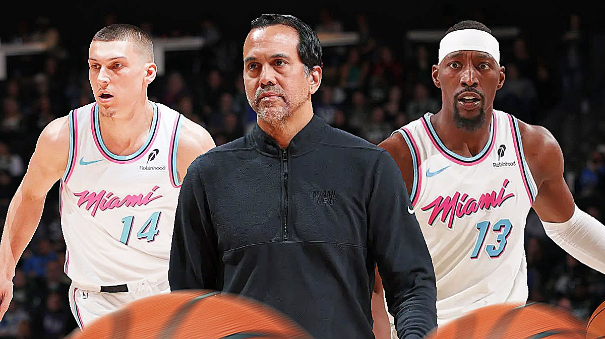 Miami Heat head coach Erik Spoelstra in the middle of Tyler Herro and Bam Adebayo on either side.