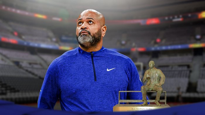 JB Bickerstaff next to the NBA Coach of the Year award.
