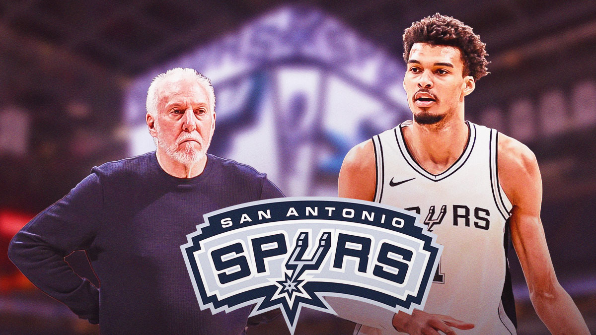 Gregg Popovich looking at VIctor Wembanyama or looking in his direction, Spurs logo