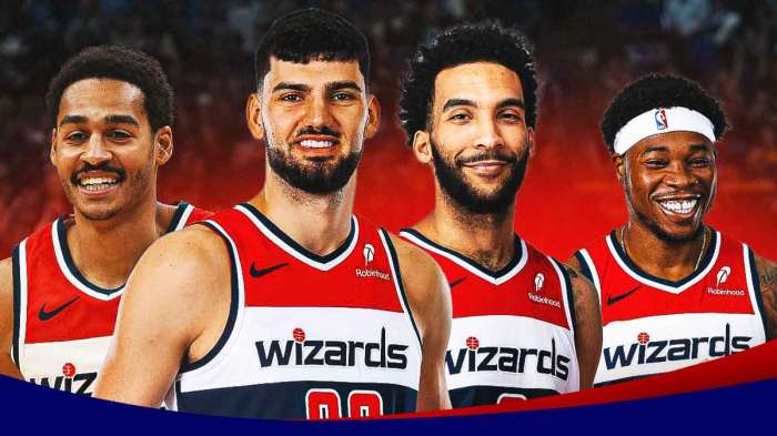 Jordan Poole next to Tristan Vukcevic, Richaun Holmes, and Justin Champagnie. All smiling.