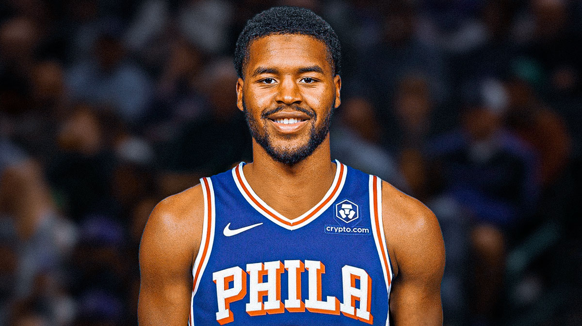 Jared Butler smiles in 76ers jersey