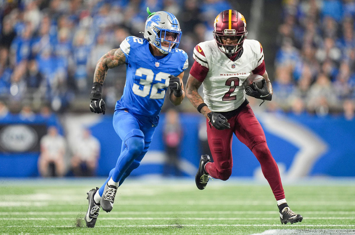 Detroit Lions safety Brian Branch (32) runs after Washington Commanders wide receiver Dyami Brown (2) in the first half of the NFC divisional round at Ford Field in Detroit on Saturday, Jan. 18, 2025.