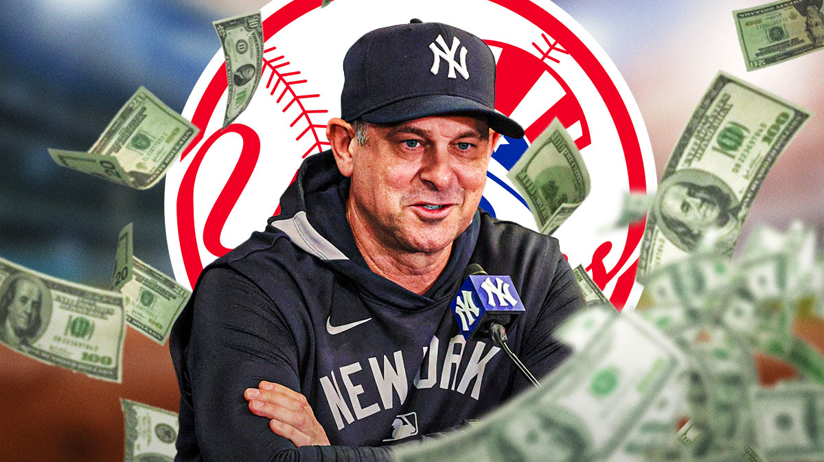 Yankees manager Aaron Boone Yankees contract extension next to a bag of cash with the Yankees logo in the background