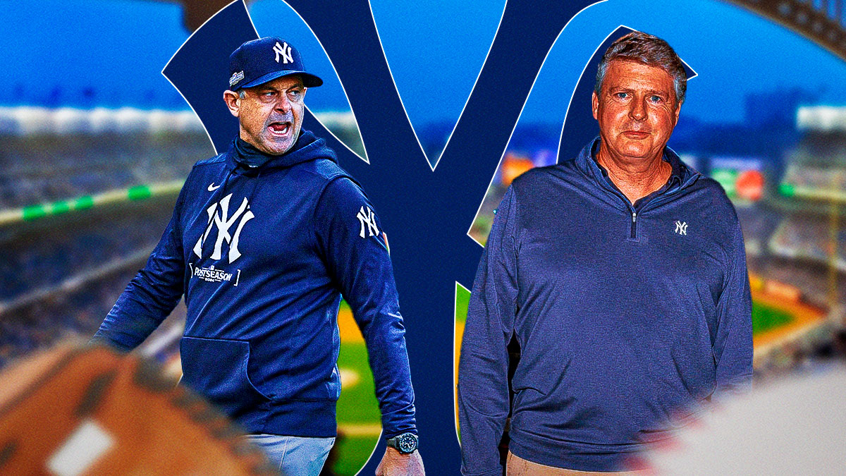 Yankees manager Aaron Boone, owner Hal Steinbrenner, Yankee Stadium in back