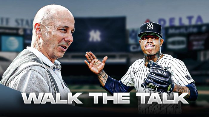 Yankees' Brian Cashman smiling at Marcus Stroman, with caption below: WALK THE TALK