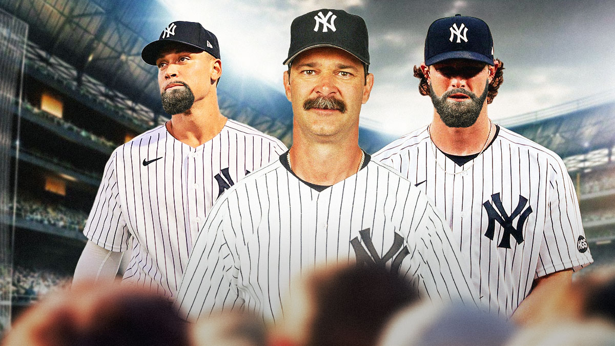 Don Mattingly with his mustache in a Yankees uniform standing next to Gerrit Cole with a beard in his Yankees uniform and Aaron Judge with a beard in a Yankees uniform.