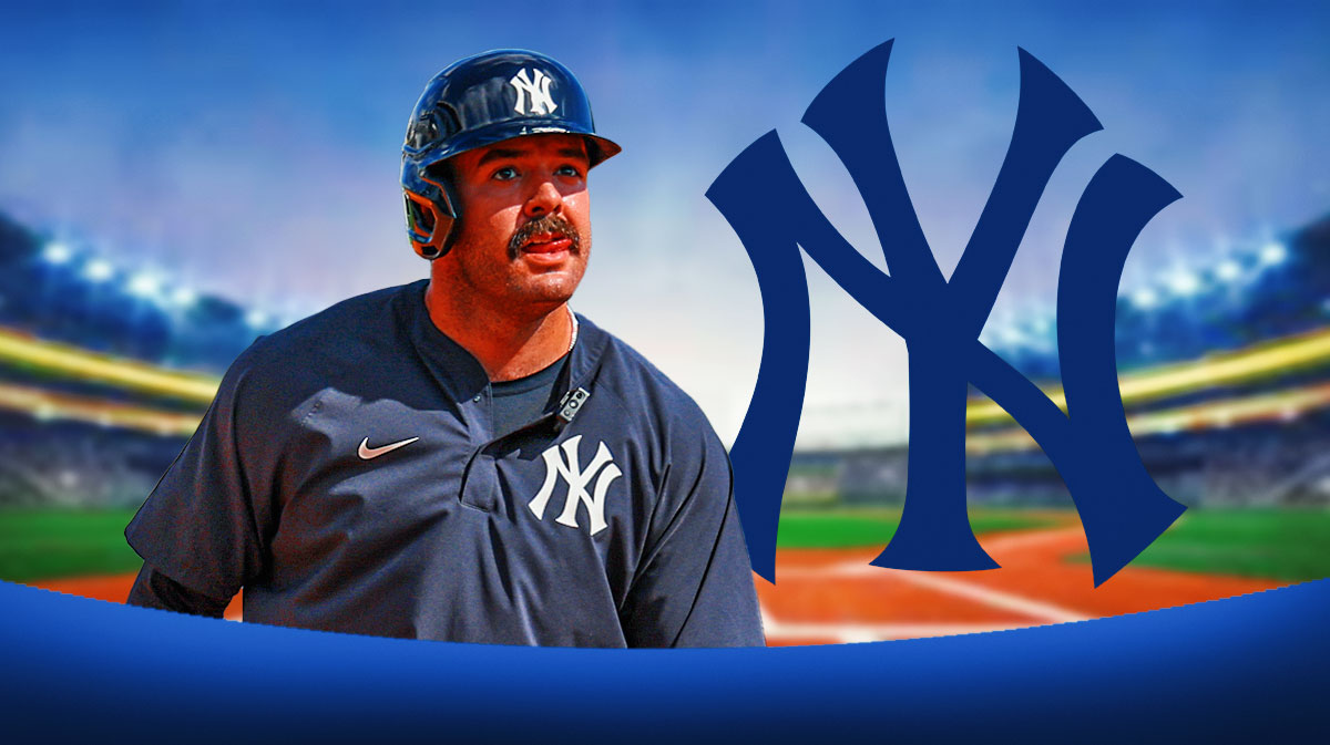 Yankees logo next to catcher Austin Wells