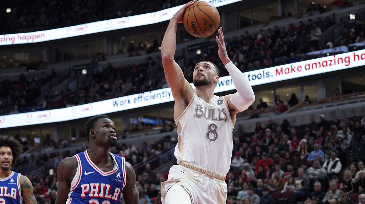 Chicago Bulls Guard Zach Avalanche (8) shoots against Philadelphia 76ers Center Adem Bona (30) during the first quarter in the United Center.