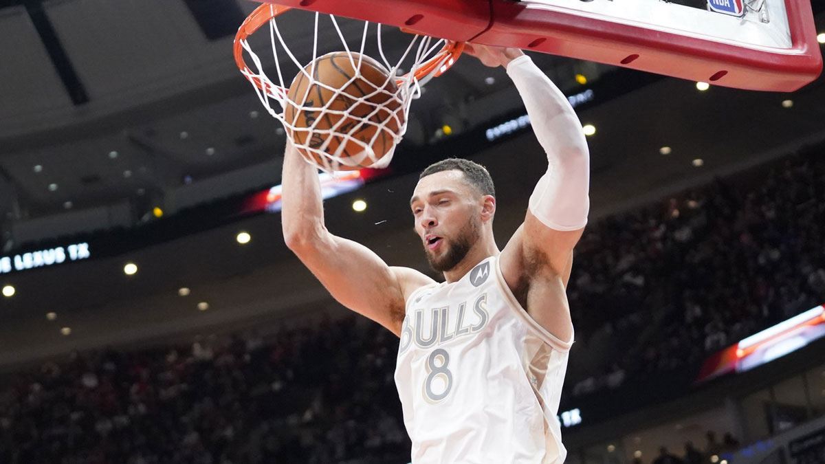 Chicago Bulls guard Zach LaVine (8) dunks the ball against the Philadelphia 76ers during the first quarter at United Center.