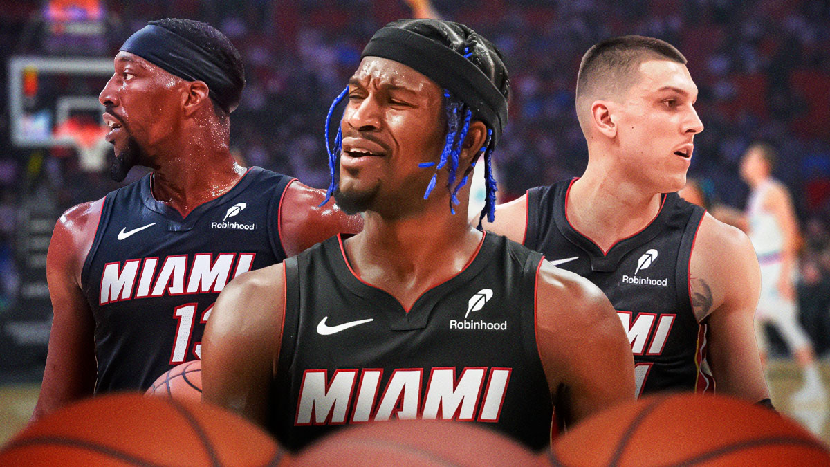 Former Miami Heat star Jimmy Butler in the middle with Bam Adebayo and Tyler Herro on either side in front of Kaseya Center.