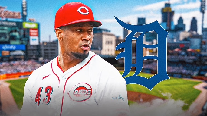 Alexis Diaz in Reds jersey, Comerica Park (Detroit) and Tigers logo behind him