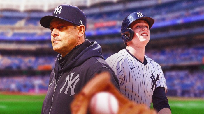 Yankees manager Aaron Boone next to catcher Ben Rice