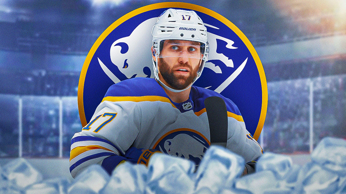 Sabres Jason Zucker next to Sabres logo