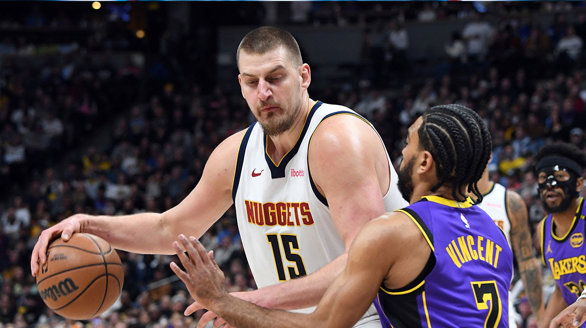 Denver Nuggets center Nikola Jokic (15) works in the post against Los Angeles Lakers guard Gabe Vincent (7) during the first half at Ball Arena