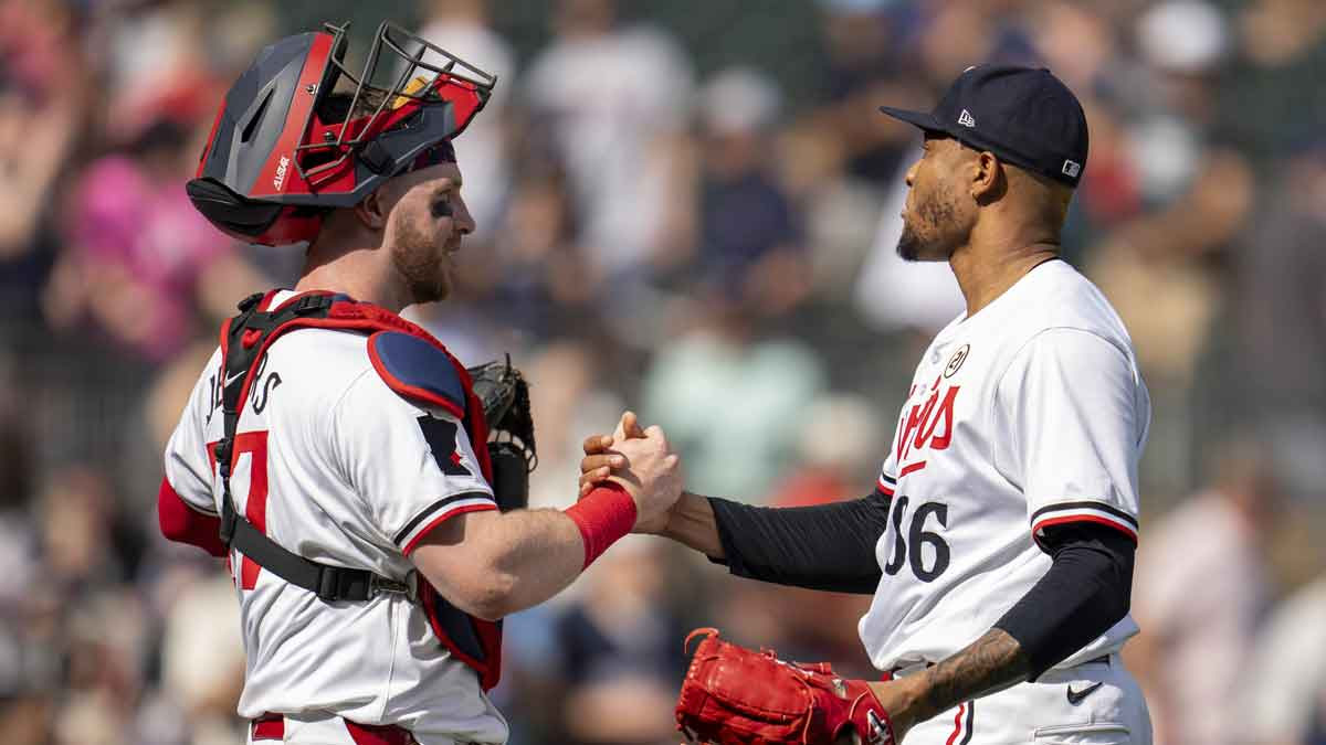 Minnesota Twins catcher Ryan Jeffers (27) celebrates with pitcher Jorge Alcala (66) after defeating the Cincinnati Reds at Target Field.
