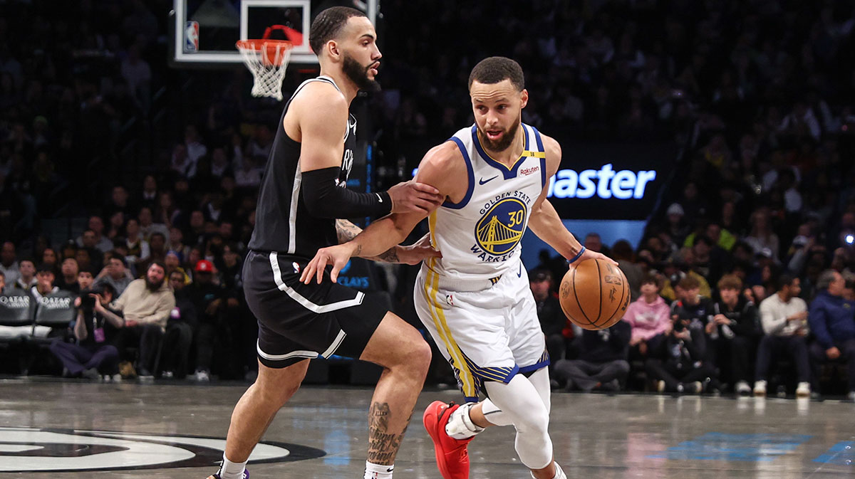 Golden State Warriors guard Stephen Curry (30) drives past Brooklyn Nets guard Tyrese Martin (13) in the first quarter at Barclays Center.