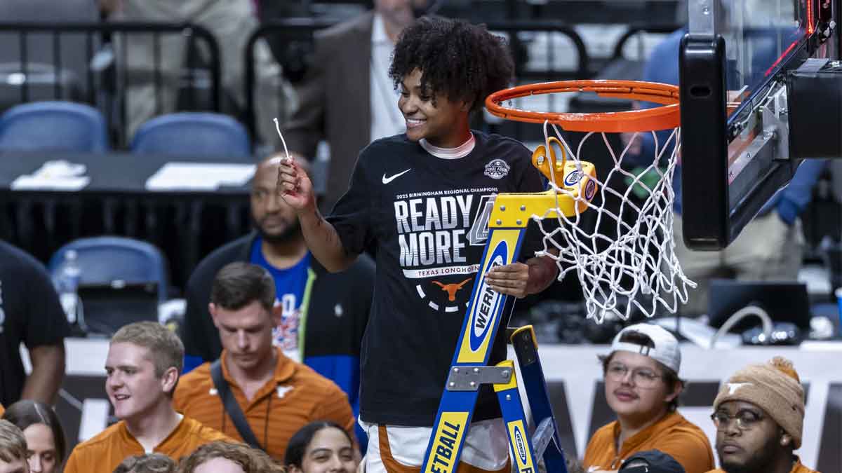 Texas Longhorns guard Rori Harmon (3) smiles after cutting the net following a win over the TCU Horned Frogs at an Elite 8 NCAA Tournament basketball game at Legacy Arena.