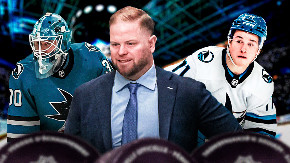 Ryan Warsofsky as Sharks coach front and center. Macklin Celebrini behind to right. Yaroslav Askarov behind to left