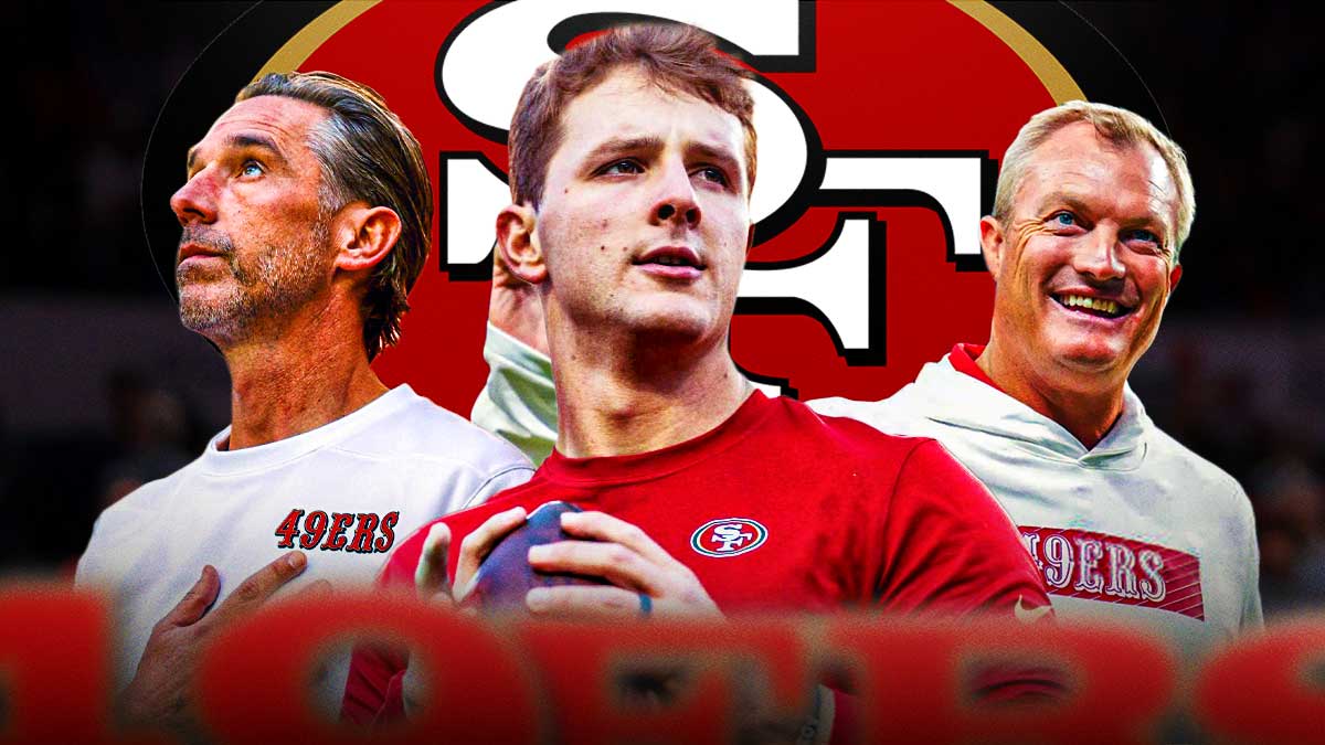 49ers GM John Lynch with 49ers head coach Kyle Shanahan. They are next to 49ers QB Brock Purdy. There is also a logo for the San Francisco 49ers.