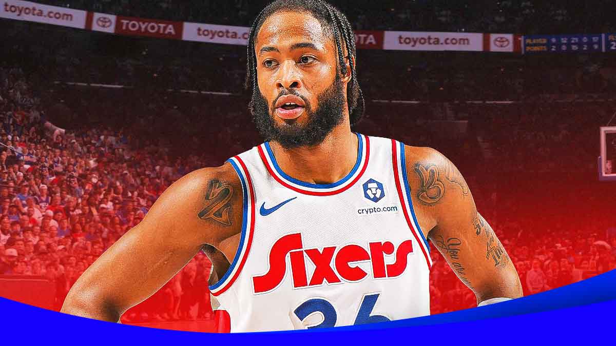 NBA player Phillip Wheeler in a Philadelphia 76ers jersey wit the 76ers arena in the background, roster signing