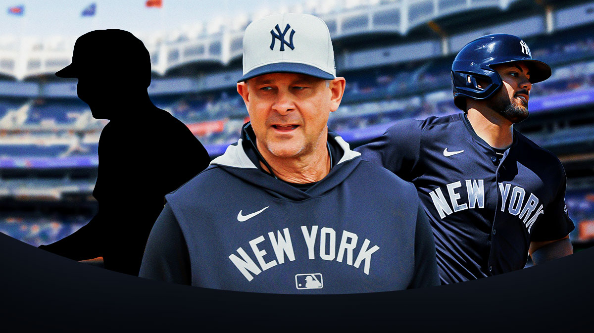 Aaron Boone front and center. Jasson Dominguez behind to right. SILHOUETTE of Ben Rice behind to left