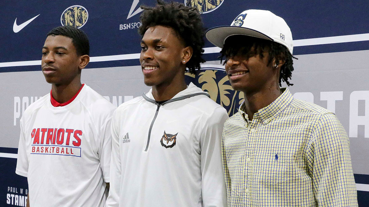 Three members of the Paul W. Bryant High basketball team signed their letters to play college basketball Tuesday. Marchello Perkins, Adrian Wooley, and Eric Grant all signed to play at colleges during the ceremony in the high school gymnasium.