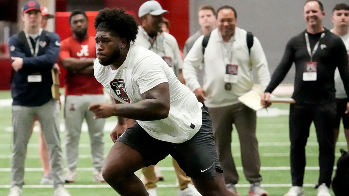 Mar 19, 2025; Tuscaloosa AL, USA; Offensive lineman Tyler Booker rusn a drill for scouts at the University of Alabama Pro Day as several Crimson Tide players worked out for NFL teams in the Hank Crisp Indoor Practice Facility.