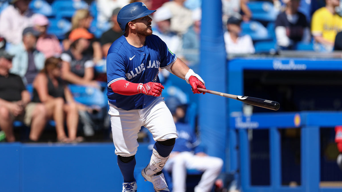 Toronto Blue Jays catcher Alejandro Kirk (30) hits an rbi single against the Boston Red Sox in the fourth inning during spring training at TD Ballpark.