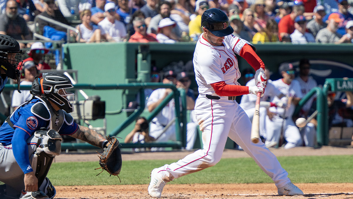 Mar 2, 2025; Fort Myers, Florida, USA; Boston Red Sox Alex Bregman (2) hits a single during the first inning of their game with the New York Mets at JetBlue Park at Fenway South. 