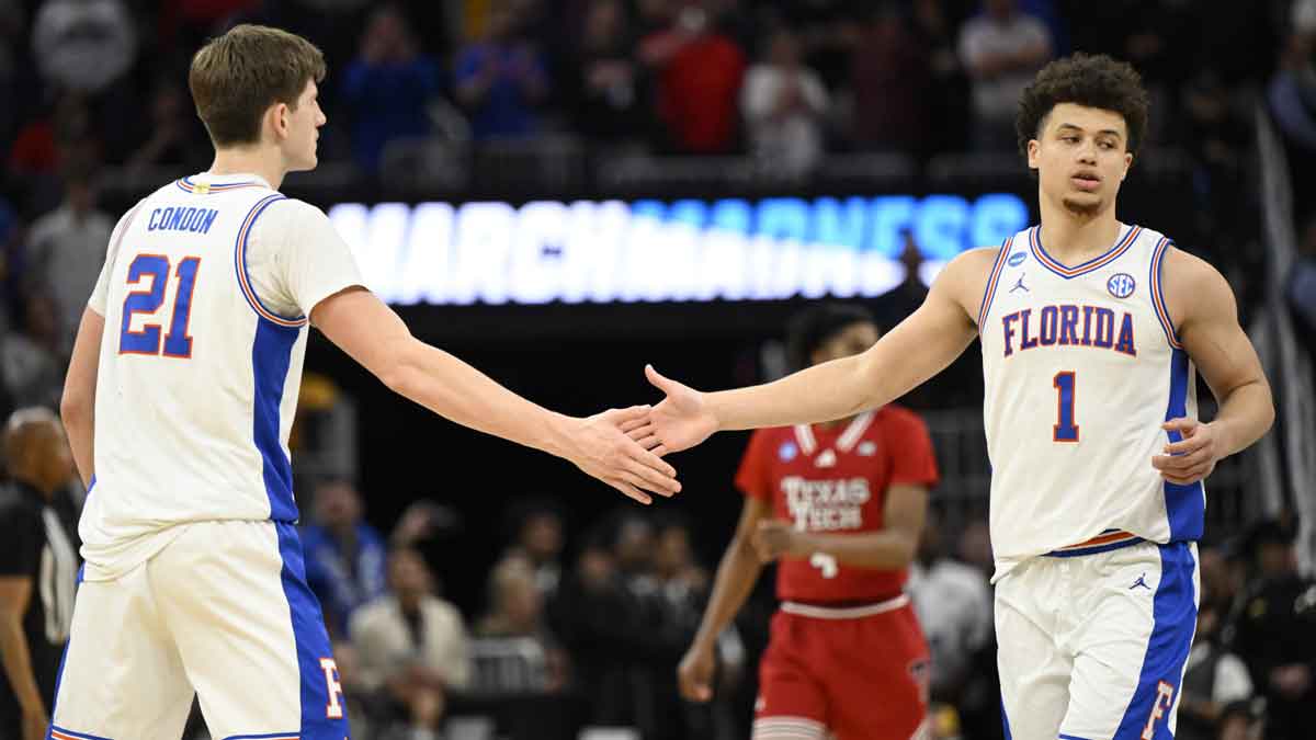 Florida Gators forward Alex Condon (21) and Florida Gators guard Walter Clayton Jr. (1) high-five during the second half against the Texas Tech Red Raiders during the West Regional final of the 2025 NCAA tournament at Chase Center. Mandatory Credit: Eakin Howard-Imagn Images