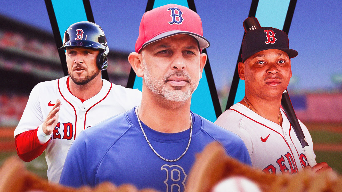 Red Sox' manager Alex Cora standing in the middle of Alex Bregman (left) and Rafael Devers (right). There is a big W in the background.