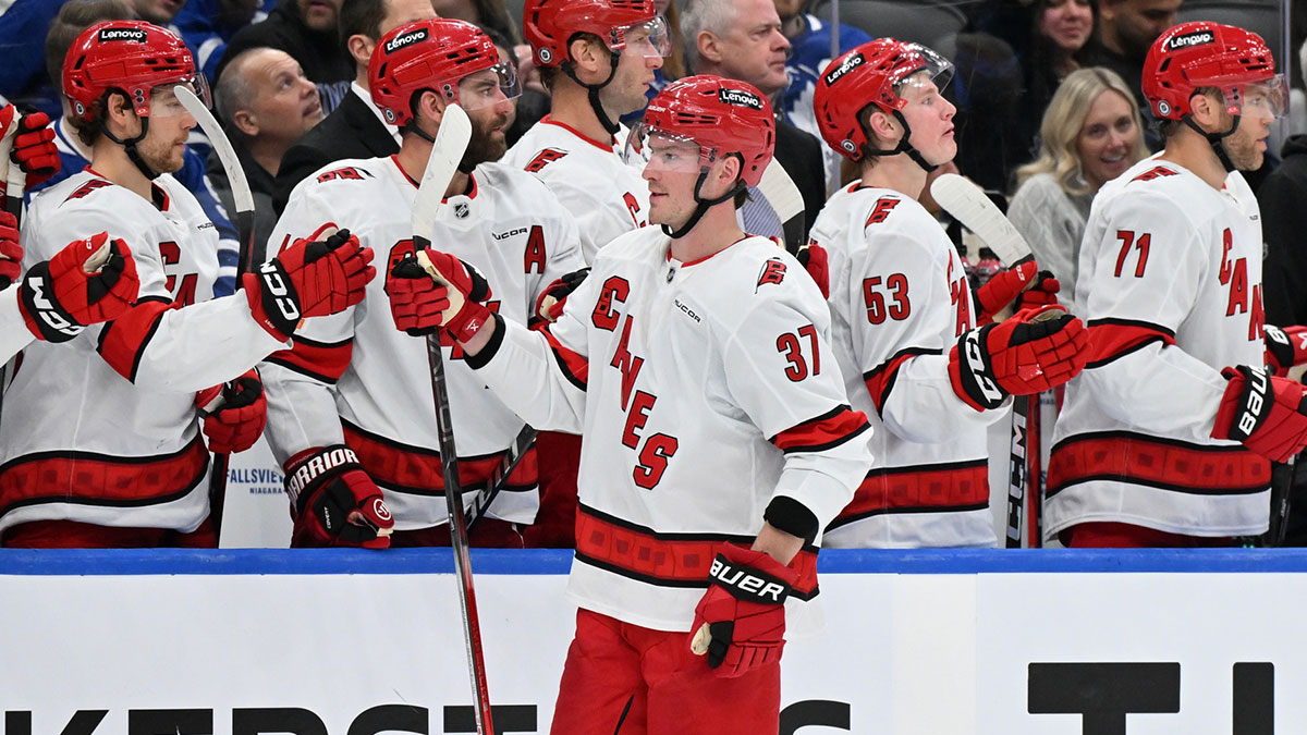 Carolina Hurricanes forward Andrei Svechnikov (37) celebrates with teammates at the bench after scoring a goal against the Toronto Maple Leafs in the third period at Scotiabank Arena.