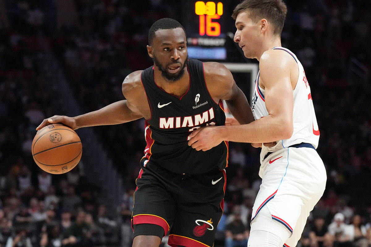 Miami Heat Andrew Wiggins striker (22) passes in front of the clippers goalkeeper Bogdan Bogdanovic (10) during the second half at Kaseya Center.