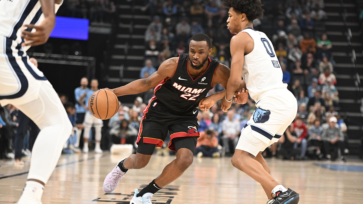 Miami Heat small forward Andrew Wiggins (22) drives into Memphis Grizzlies forward Jalen Wells (0) in the first quarter of the game against the Memphis Grizzlies at FedExForum.