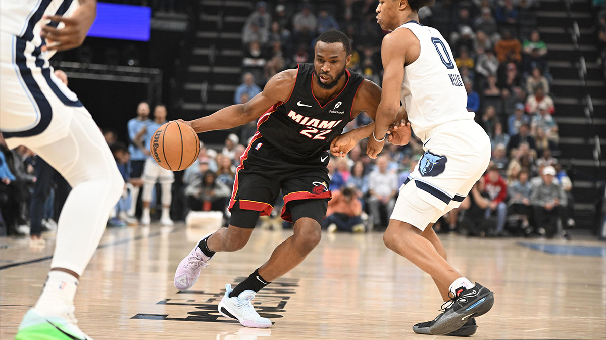 Miami Heat small forward Andrew Wiggins (22) drives into Memphis Grizzlies forward Jalen Wells (0) in the first quarter of the game against the Memphis Grizzlies at FedExForum.