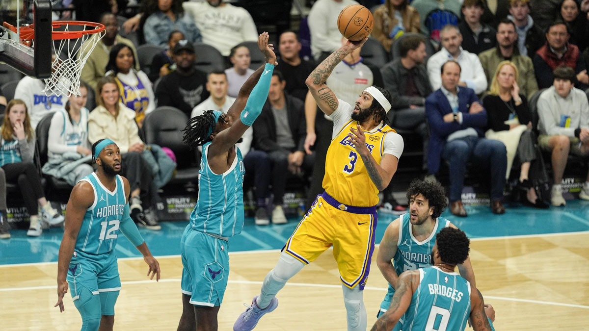 Los Angeles Lakers forward Anthony Davis (3) shoots a jumper over Charlotte Hornets center Mark Williams (5) during the second quarter at the Spectrum Center.