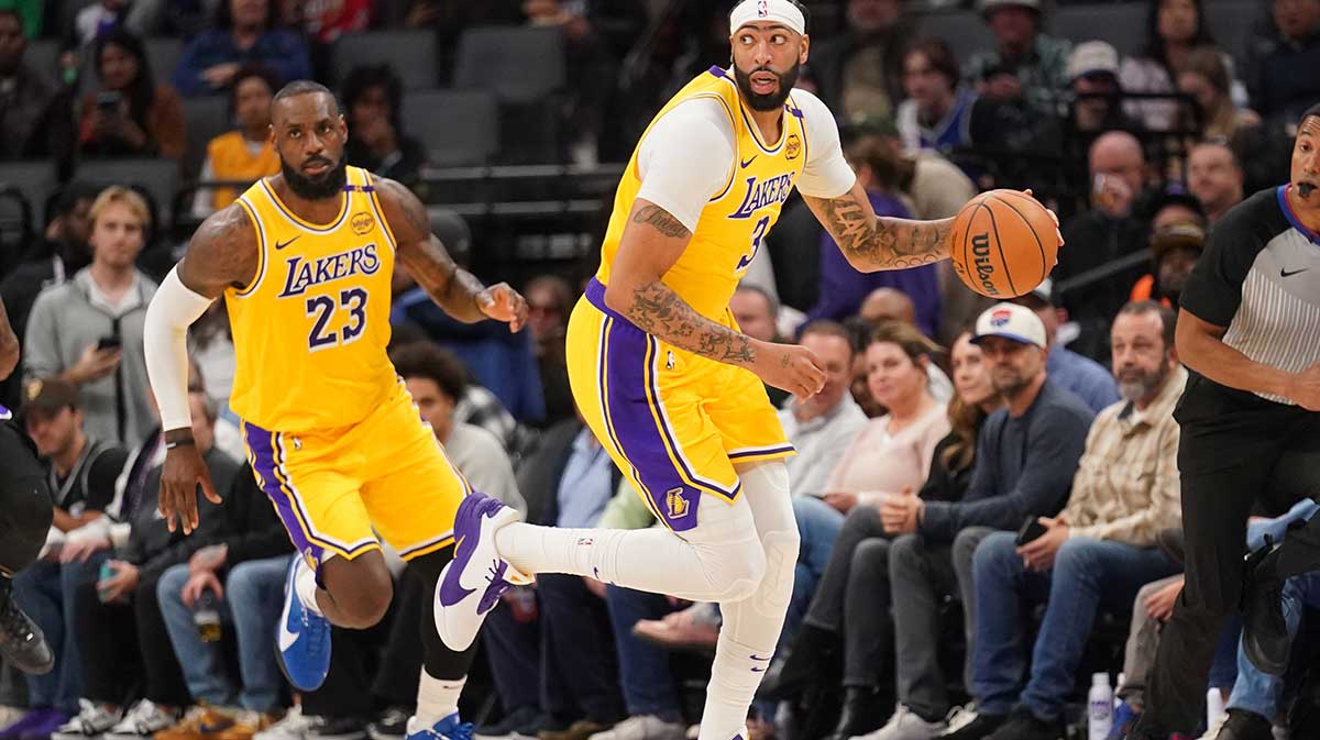 Los Angeles Lakers forward Anthony Davis (3) dribbles the ball next to forward LeBron James (23) against the Sacramento Kings in the first quarter at the Golden 1 Center.
